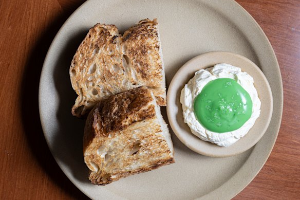 Tyga’s kaya toast is made with toasted sourdough (left), butter whipped with coconut custard, and a pool of pandan cream.