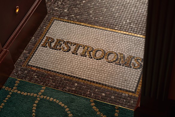 If the mosaic “restrooms” floor sign at Vito’s toilet entrance glitters, that’s because the tiles are made of real gold.