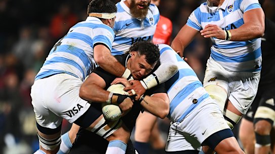 David Havili is tackled.