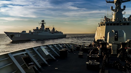A Chinese frigate and a guided missile destroyer on manoevres in the South China Sea in 2020
