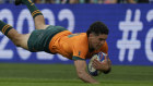 Australia’s Ben Donaldson crosses for one of the two tries.