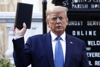 Trump holds a Bible outside St John's Church, across Lafayette Park from the White House, in a melodramatic photo opportunity. 