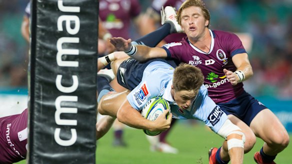 Sealing the deal: Alex Newsome dives over for the Waratahs at the SCG.