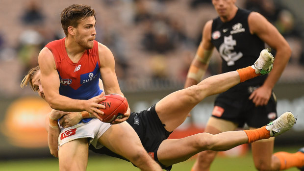 Blindsided: Carlton's Nick Graham launches into a tackle on Jack Viney.