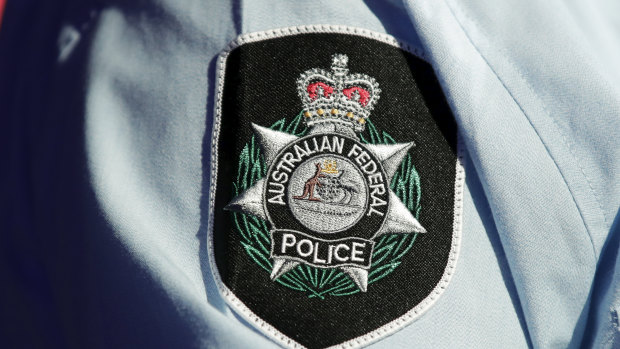 The AFP agreed to pay $1.25 million to settle a claim against the force and four officers without admitting any wrongdoing.