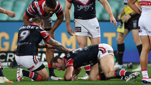 Boyd Cordner struggles to get up after hitting his head on the ground against the Knights.