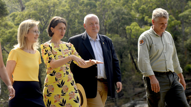 NSW Minister for the Environment Gabriel Upton, NSW Premier Gladys Berejiklian, Lee Evans MP and Glenn Meade, Operations Manager of the National Park and Wildlife Service at the Royal National Park, south of Sydney on Monday.