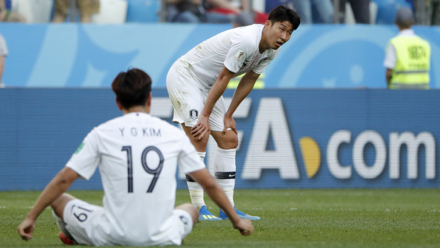 South Korea's Son Heung-min, right, and Kim Young-gwon show their disappointment against Sweden.