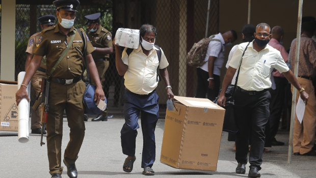 Sri Lankan polling officers dispatch election material to polling centers ahead of the parliamentary elections in Colombo, Sri Lanka.