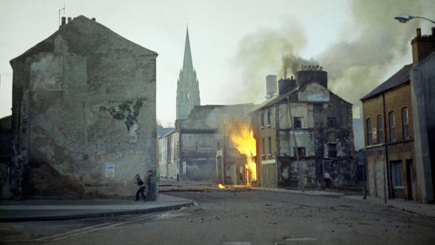 A building burns in the Bogside district of Londonderry, Northern Ireland, in the aftermath of Bloody Sunday in February 1972.