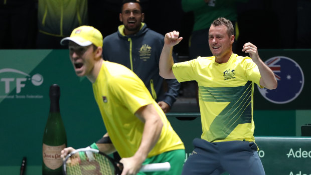 Lleyton Hewitt, right, celebrates Australia's doubles win over Colombia.