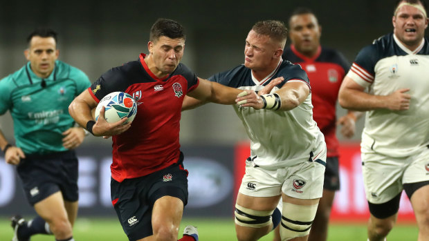 Ben Youngs of England holds off Hanco Germishuys of USA during a 2019 Rugby World Cup match. 