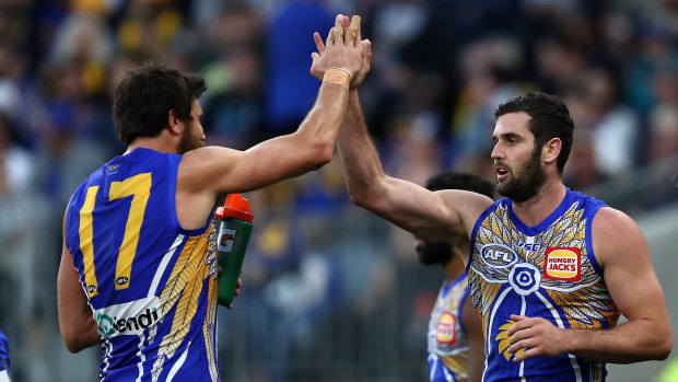 Strike force: Josh Kennedy congratulates Jack Darling (right) on booting another major for the Eagles.