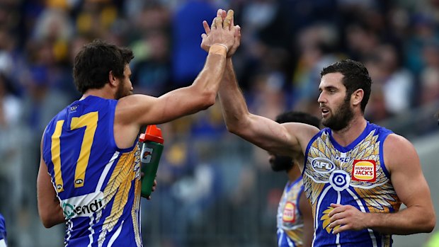 Strike force: Josh Kennedy congratulates Jack Darling (right) on booting another major for the Eagles.