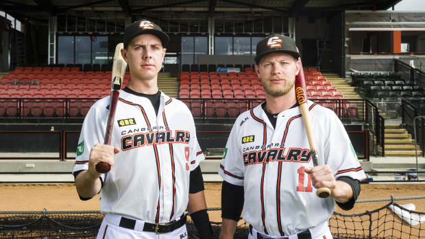 Canberra Cavalry players Robbie Perkins and Kyle Perkins in front of the redeveloped grandstand.