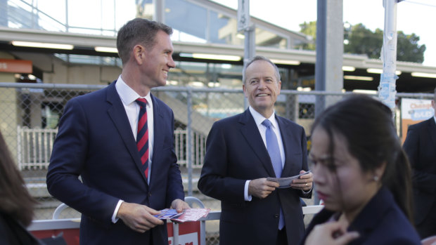 Labor candidate for Reid Sam Crosby and Opposition Leader Bill Shorten campaigning at Rhodes train station.