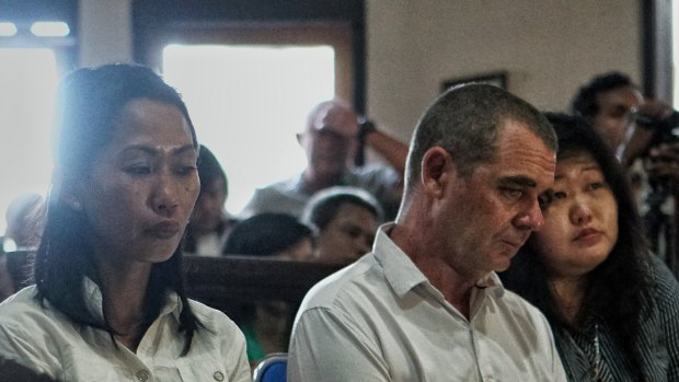 Brendon Luke Johnsson (centre) and his girlfriend Remi Purwanti (left) were sentenced to five years and four months' jail on drugs charges.