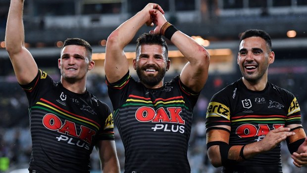 Josh Mansour (centre) celebrates Penrith's preliminary final victory with Nathan Cleary (left) and Tyrone May in October.