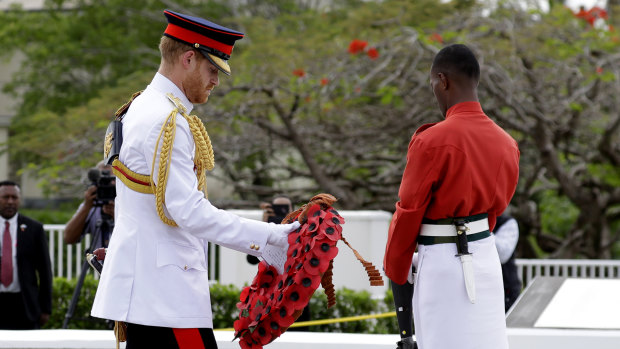 Britain's Prince Harry prepares to lay a wreath at the Suva War Memorial in Suva, Fiji, Wednesday, Oct. 24, 2018. Prince Harry and his wife Meghan are on day nine of their 16-day tour of Australia and the South Pacific.