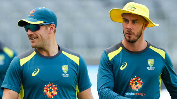 Spirited: Aaron Finch (left) and Chris Lynn during a training session at Optus Stadium in Perth.