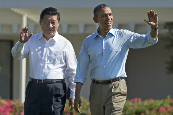 Chinese President Xi Jinping and former US President Barack Obama walk at the Annenberg Retreat of the Sunnylands estate in Rancho Mirage in June 2013. 
