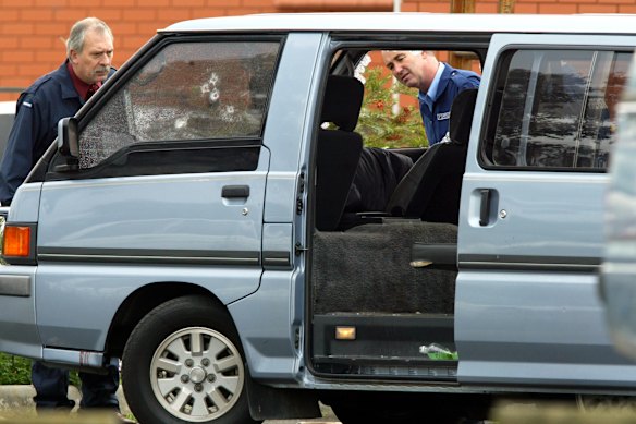 Officers inspect the van in which Jason Moran and Pasquale Barbaro were shot in Pascoe Vale in June 2003.