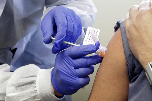 A trial participant receives a shot in the first-stage safety study of Moderna's COVID-19 vaccine. 