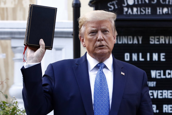 Trump holds a Bible outside St John's Church, across Lafayette Park from the White House, in a melodramatic photo opportunity. 