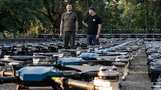 Mykhailo Fedorov, Ukrainian minister of digital transformation, right, and Yuriy Shchygol, head of State Special Communications Service, with some of the 1700 drones that are being sent to the frontline.