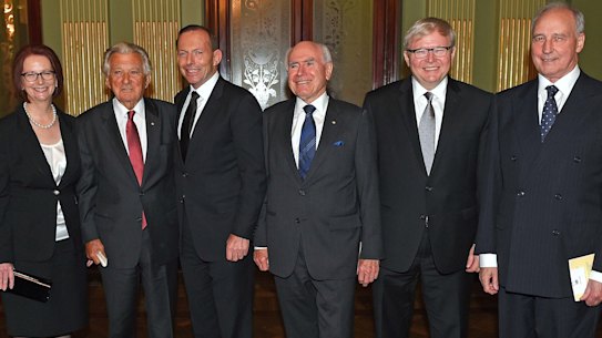 Former Prime Ministers of Australia, from left to right, Malcolm Fraser, Julia Gillard, Bob Hawke, Prime Minister Tony Abbott, John Howard, Kevin Rudd and Paul Keating pose for a photograph at the completion of a memorial service for former Prime Minister Gough Whitlam, at the Town Hall in Sydney, Wednesday, Nov. 5, 2014. Whitlam, who was Australia's 21st prime minister, died on Oc. 21 at the age of 98. (AP Photo/Dan Himbrechts, Pool)