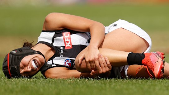 In agony: Collingwood’s Brittany Bonnici clutches at her knee during round eight. 