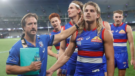 Luke Beveridge and Bailey Smith leave the field after the Bulldogs’ Round 5 win over North Melbourne.