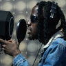 Jean Patrick Niambe, a hip-hop artist known as Dofy who often composes in Nouchi, a slang once crafted by petty criminals, records a new song in a studio in Abidjan, Ivory Coast.