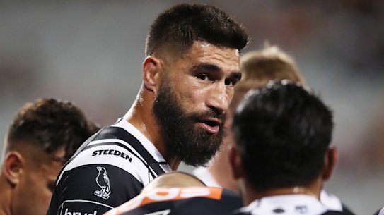 James Tamou gives a pep talk to Tigers teammates behind the line after another Titans try.