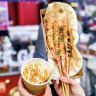 Market stalls sell quick, spice-laden street fare.