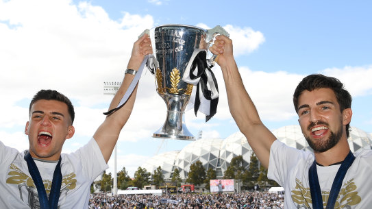 The Daicos boys, Nick and Josh, with the 2023 premiership cup.