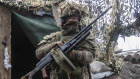 Investor flashpoint. A Ukrainian soldier stands at the line of separation from pro-Russian rebels, Donetsk region, Ukraine.