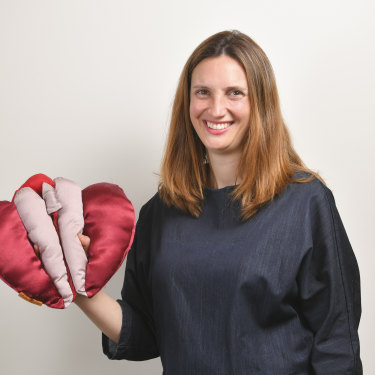 Occupational therapist Anita Brown-Major and her satin vulva puppet, which she uses in teaching.