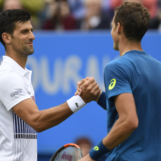 Novak Djokovic of Serbia shakes hands with Vasek Pospisil of Canada after a match in England. The duo are united in their belief in a players’ union.