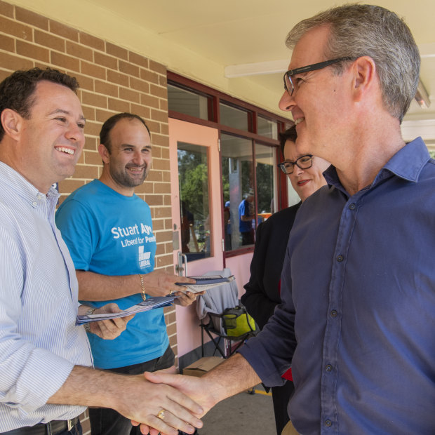 Stuart Ayres shaking hands with Michael Daley in South Penrith. 