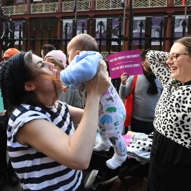 Supporters of safe zones outside abortion clinics celebrate NSW laws in 2018 that prevent women being harassed. 