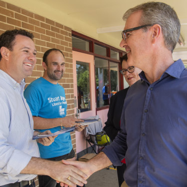 Stuart Ayres shaking hands with Michael Daley in South Penrith. 