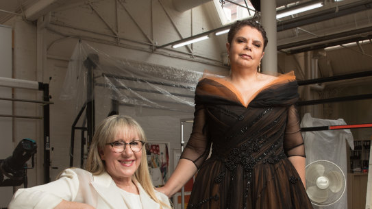 At the Australian Tapestry Workshop, Deborah Cheetham wears a gown designed by Linda Britten based on a work by Nanyuma Napangati and Polly Brown Nangala.
