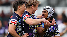 Sualauvi Faalogo celebrates with Storm teammates after scoring a try against Manly.