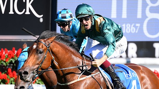 Hugh Bowman gives a shout as King's Legacy gets the better of Prague in the Sires Produce.