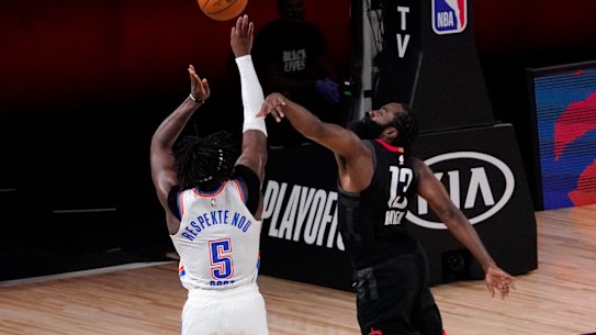 Houston's James Harden blocks a three-point attempt from Thunder's Luguentz Dort.