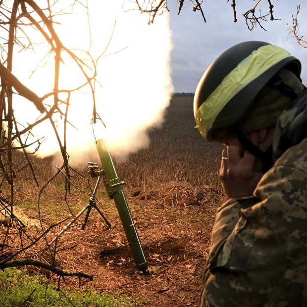 Soldiers with the Ukrainian army’s 68th Brigade fire a mortar at Russian positions in the Donetsk region.