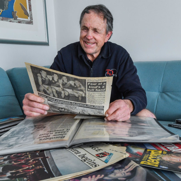 Terry Daniher with the clippings from that famous day he played with his brothers for Essendon in 1990.