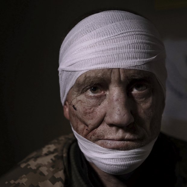 At a medical stabilisation point in Bakhmut, Ukrainian soldier Oleh Nazarov, 51, has sustained head, neck and back injuries from a grenade attack in his trench.