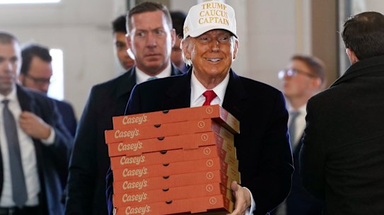Republican presidential candidate former President Donald Trump arrives to deliver pizza to fire fighters